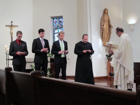 This year's novices promising to obey the Paulist Constitution and professing their belief that they are called to be missionaries.