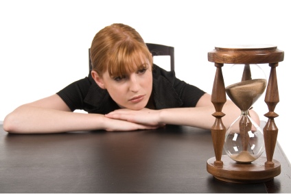 woman-watching-hourglass