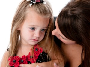 1381656446_Grieving-girl-with-mother