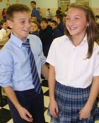 2kids in catholic uniforms