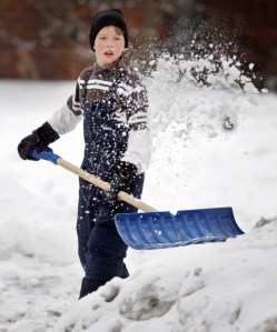 boy shoveling snow