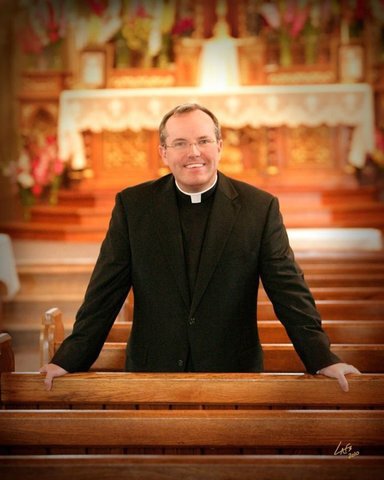 happy-mid-life-priest